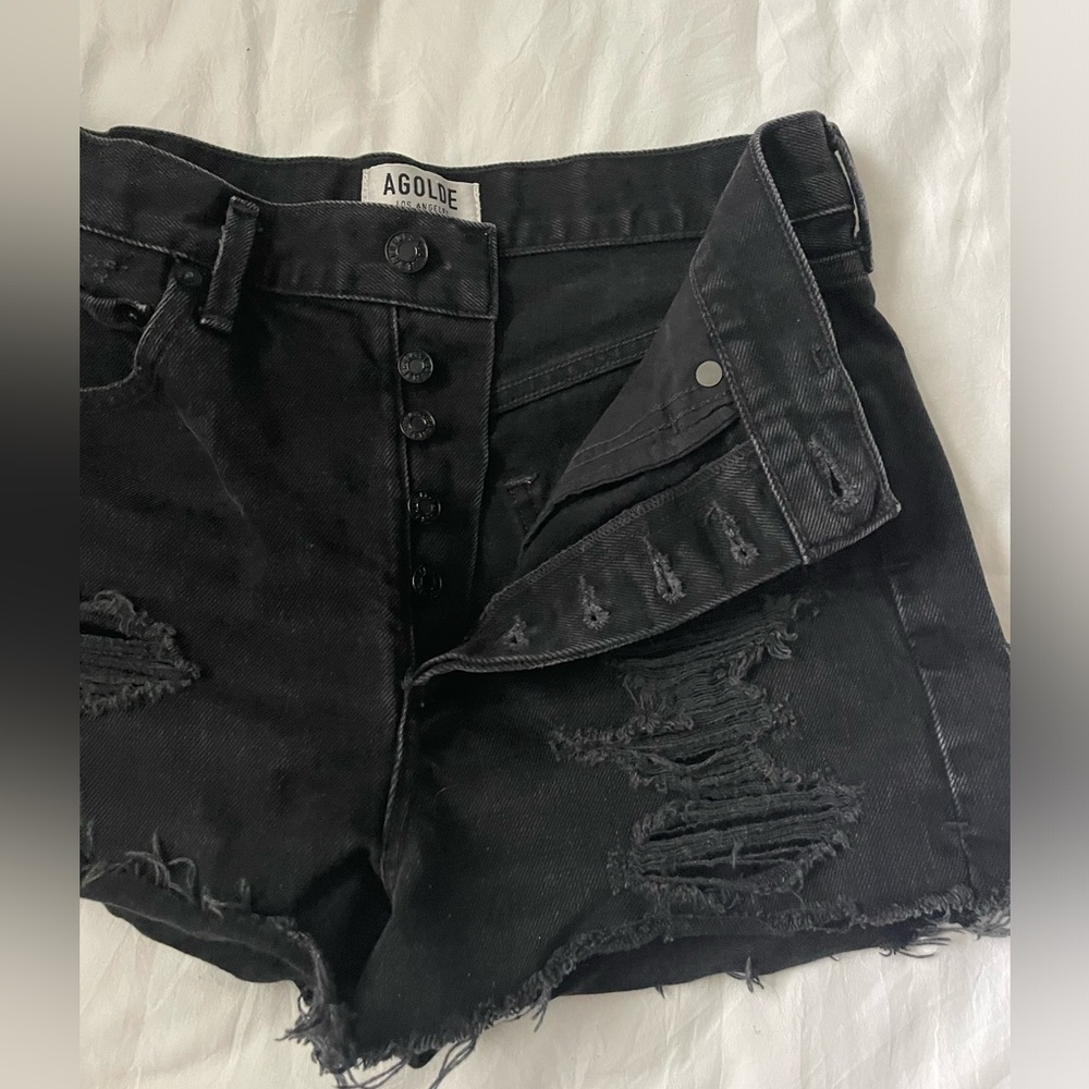 Agolde black jean shorts with rips. Size 27.